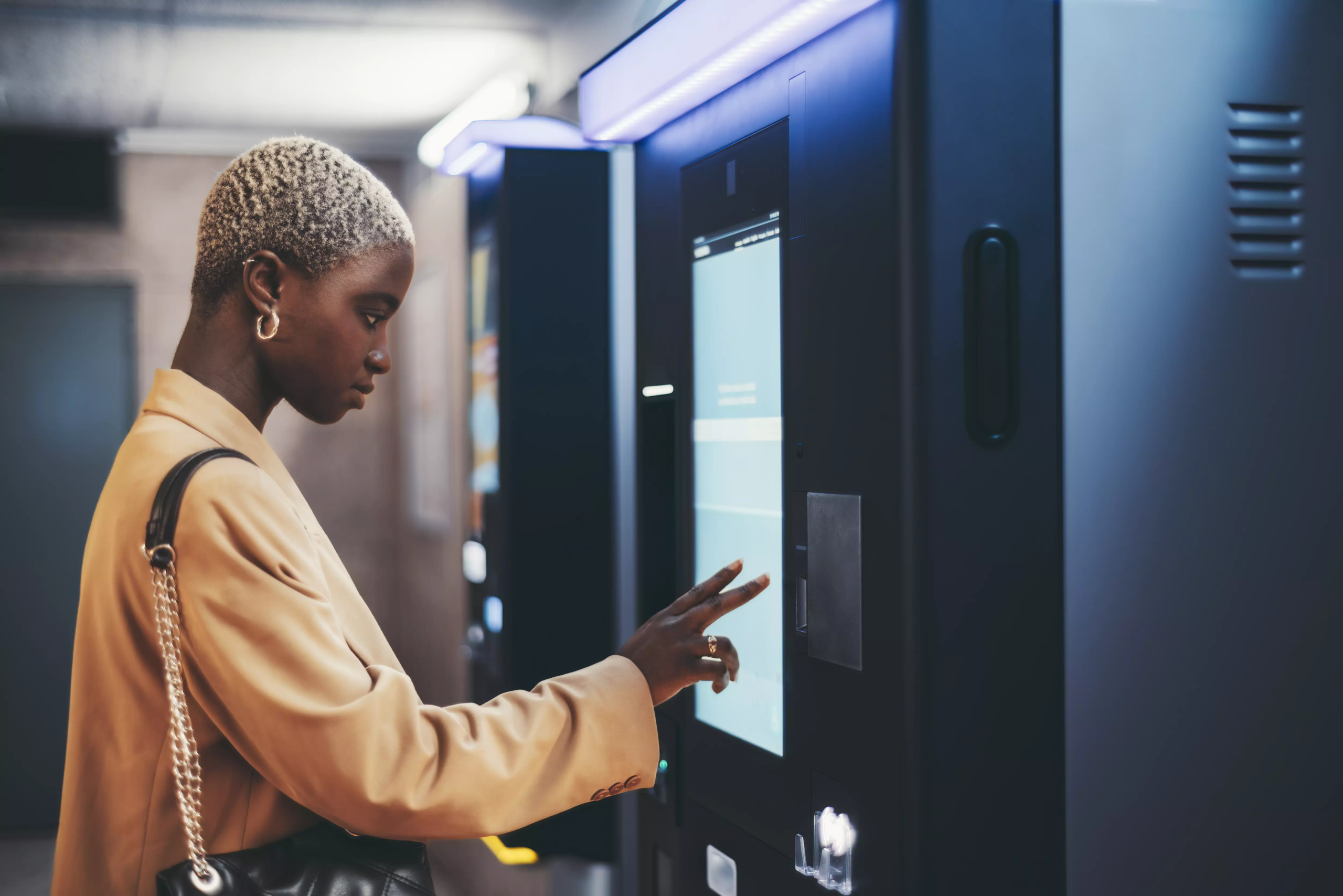 african-girl-using-ticket-terminal-2024-10-18-09-46-16-utc (1)